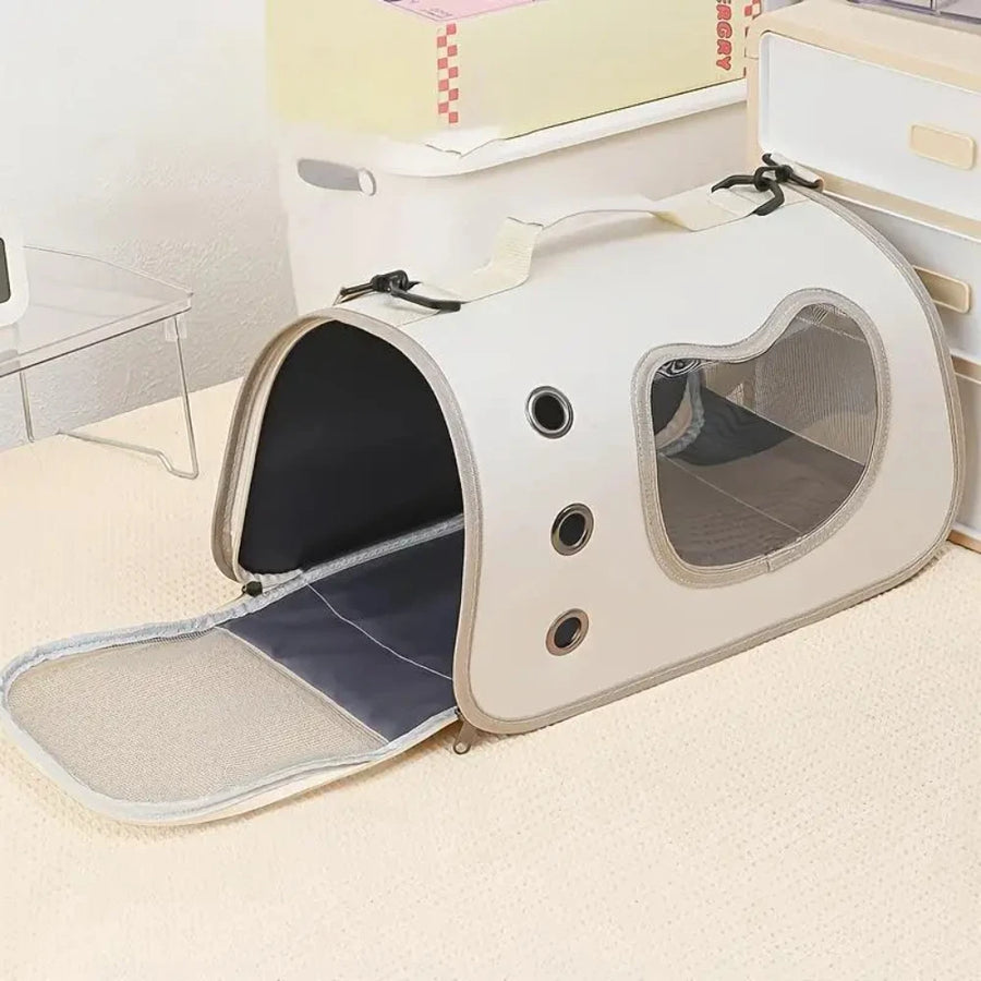 Beige pet carrier bag with the front flap open showing breathable mesh