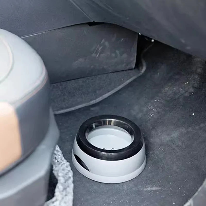 Dog in a car front seat with an anti-spill pet water bowl