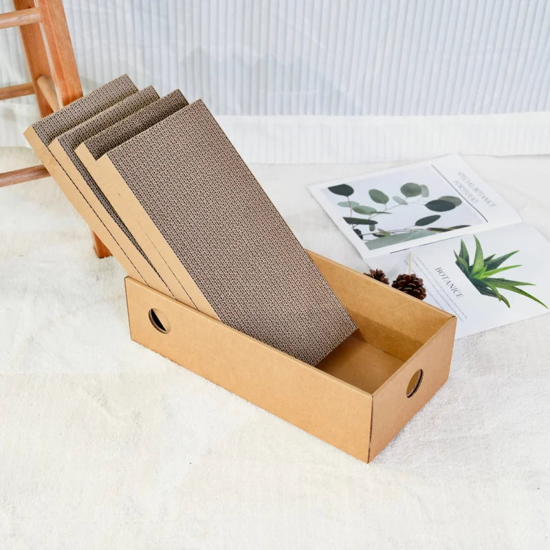 Cardboard cat scratcher box with an angled corrugated scratching pad in a bright room