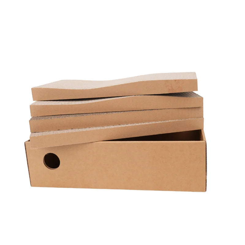 Stack of corrugated cardboard scratching pads beside the scratcher box